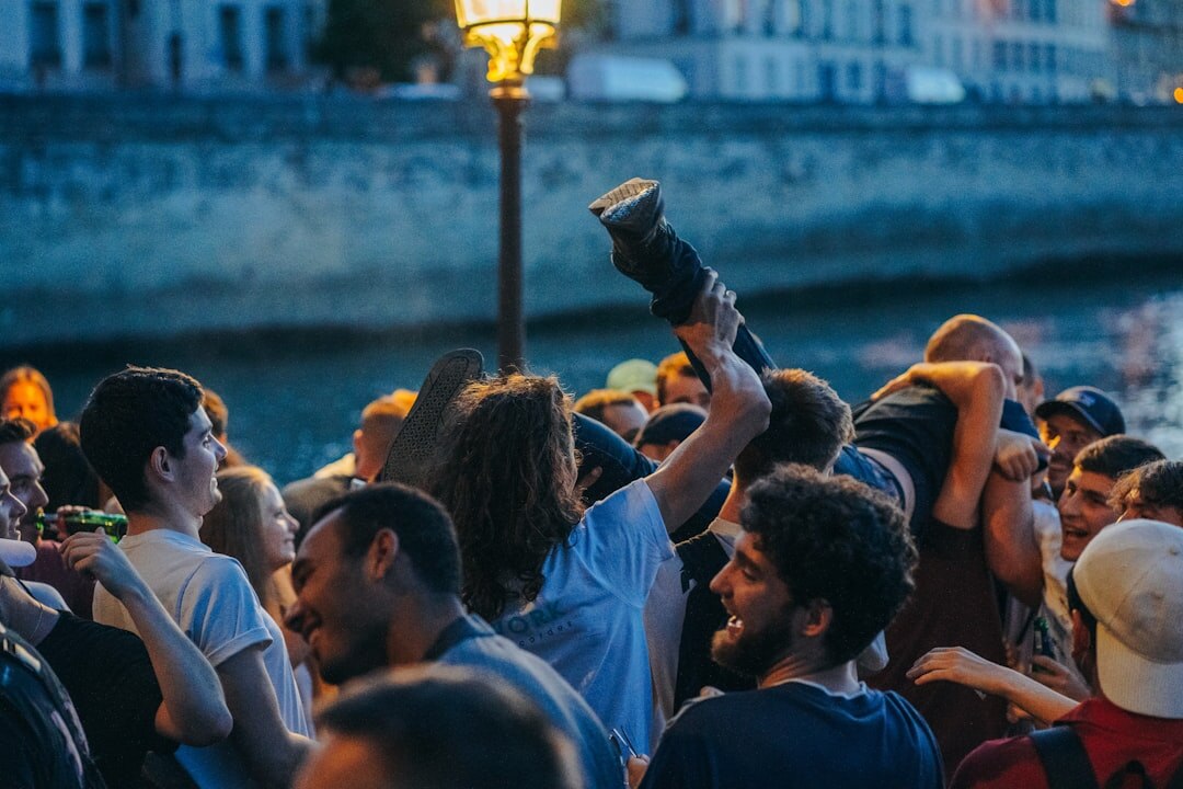 Photographers with cameras and long lenses at a night event