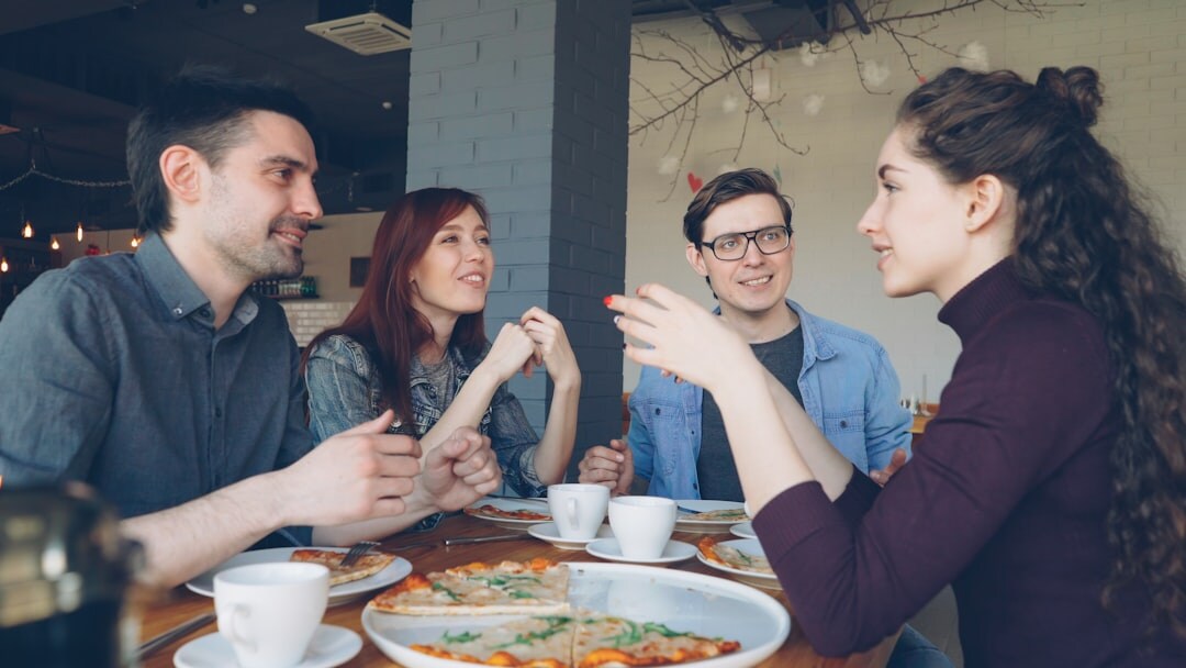 group of friends reconciling at cafe
